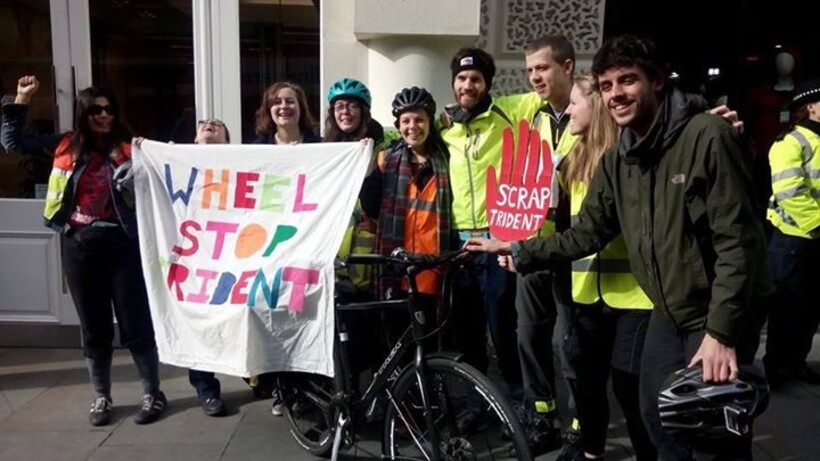 Young Quakers in front of banner reading Wheel Stop Trident