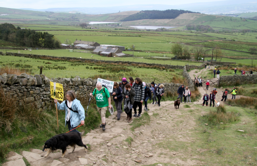 A group of people ascending Pendle Hill