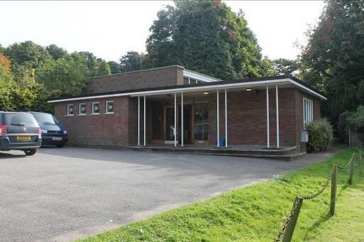 Simple modern style designed single-storey house with a garden.