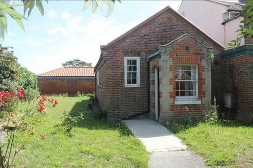 Small well presented building with attached burial grounds.