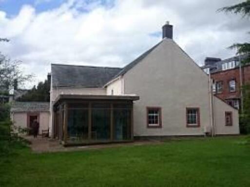 Modern white meeting house which retains some historic two upper galleries in meeting room.