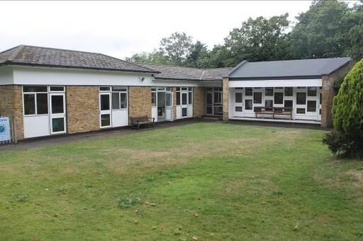 Modern design building with spacious car park.