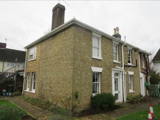 Former residence with a pleasant design retains original features on the outside.