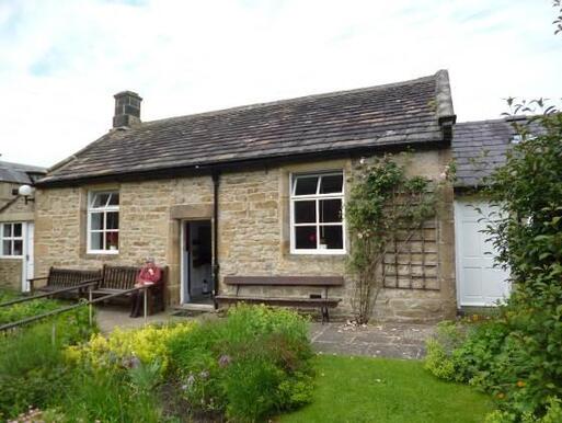 Old small meeting house, retaining historic fittings of various phases.