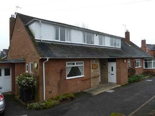 A semi-detached house with the adjoining bungalow on orchard.