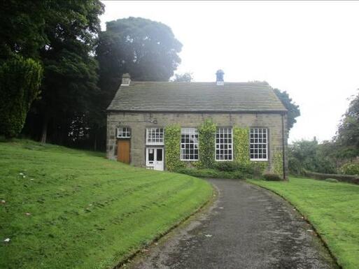 Stone built house isolated with spacious park.