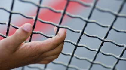 hand on fence