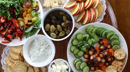 A table with a food platter on offer.