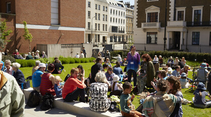 People gathered outside Friends House in London.