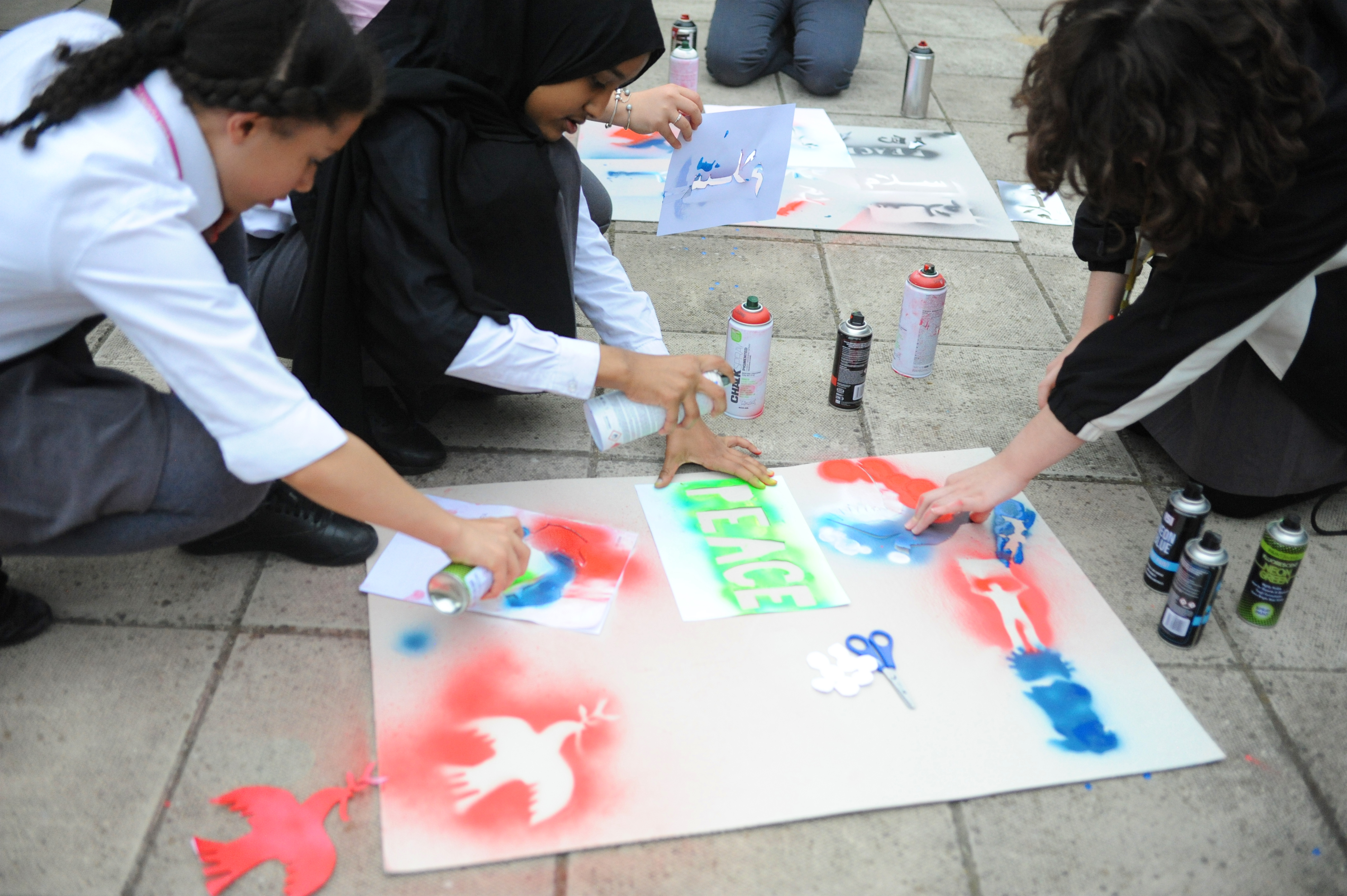 4 pupils spray graffiti doves