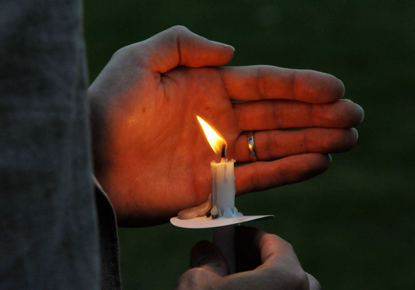 hand holding a candle