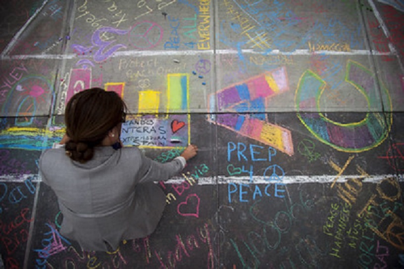 colourful messages for peace chalked on pavement