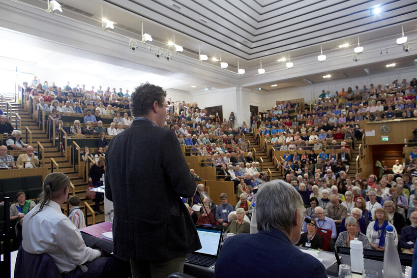 Paul Parker (far left) acting as Recording Clerk for Yearly Meeting 2019, taking place in The Light at Friends House, London. Image: BYM