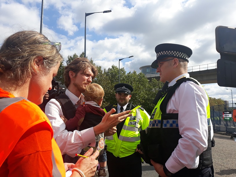 2 police oliver holding thomas and observer notes