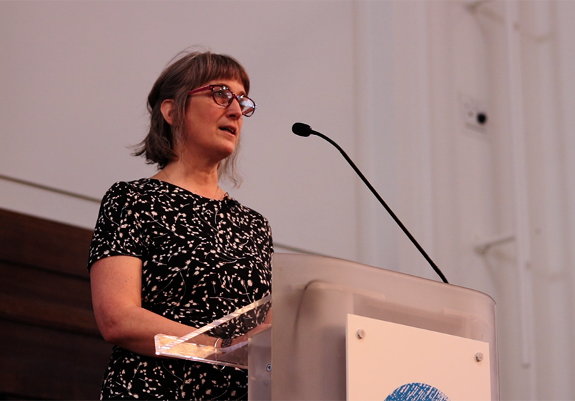 Woman standing at podium