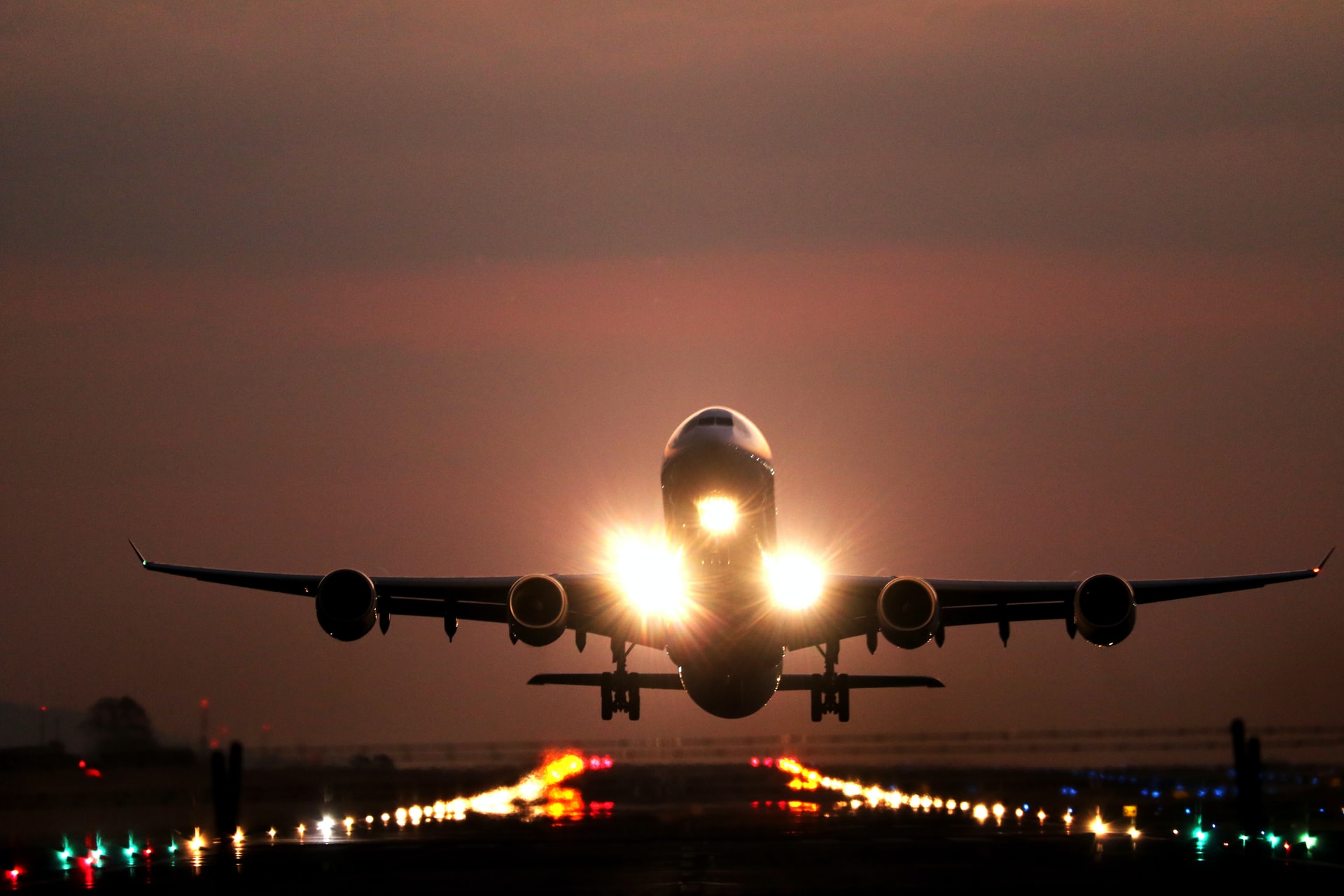 Plane landing at sunset