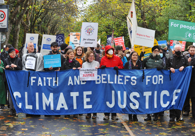 people and banners of all faiths