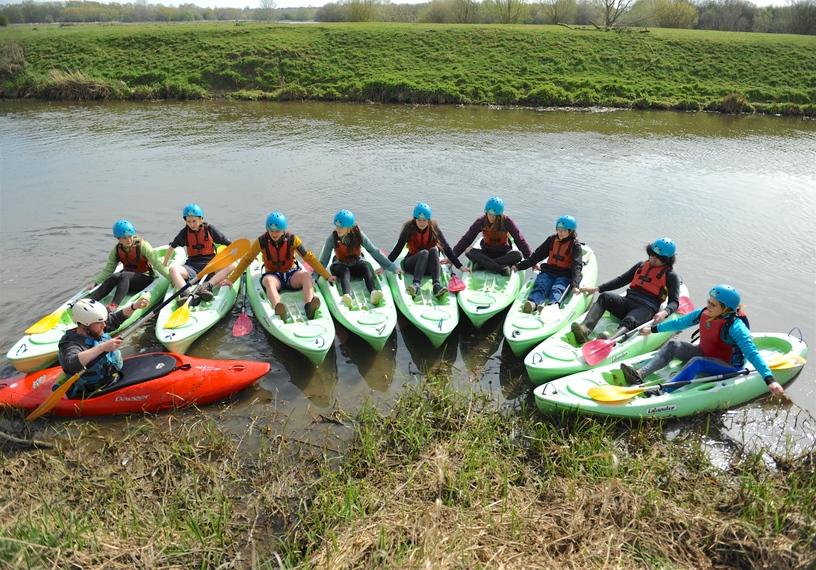 young people in kayaks