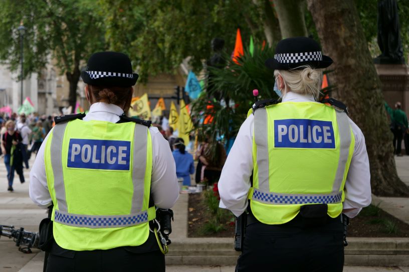 Back of two police women