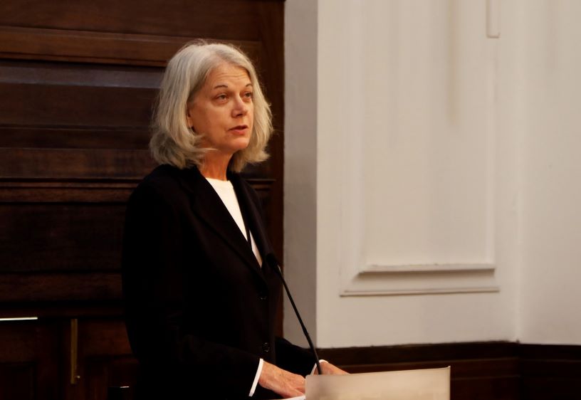 Woman standing at lectern