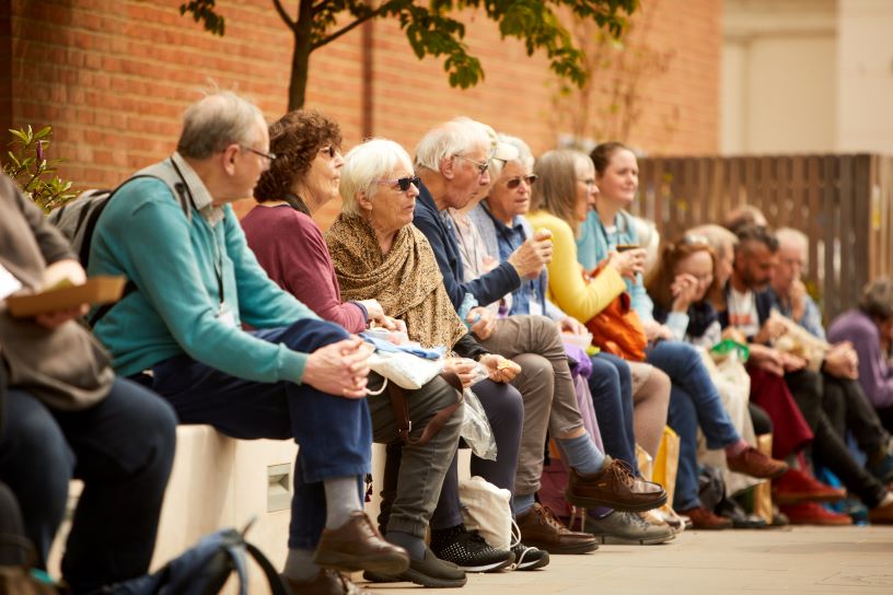 people sitting on a wall