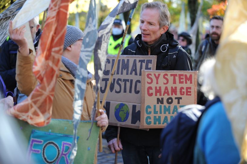 Colourful protest banners and man