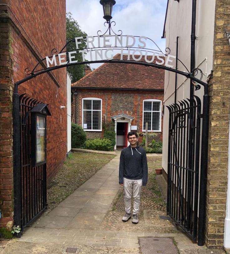 Matt Rosen underneath a sign saying Friends Meeting House at Leighton Buzzard Meeting