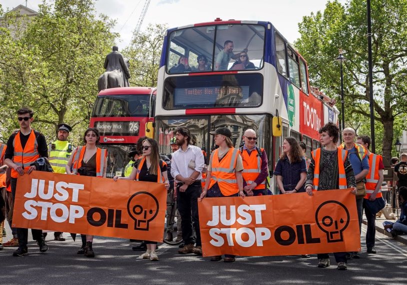 Protestors in front of buses