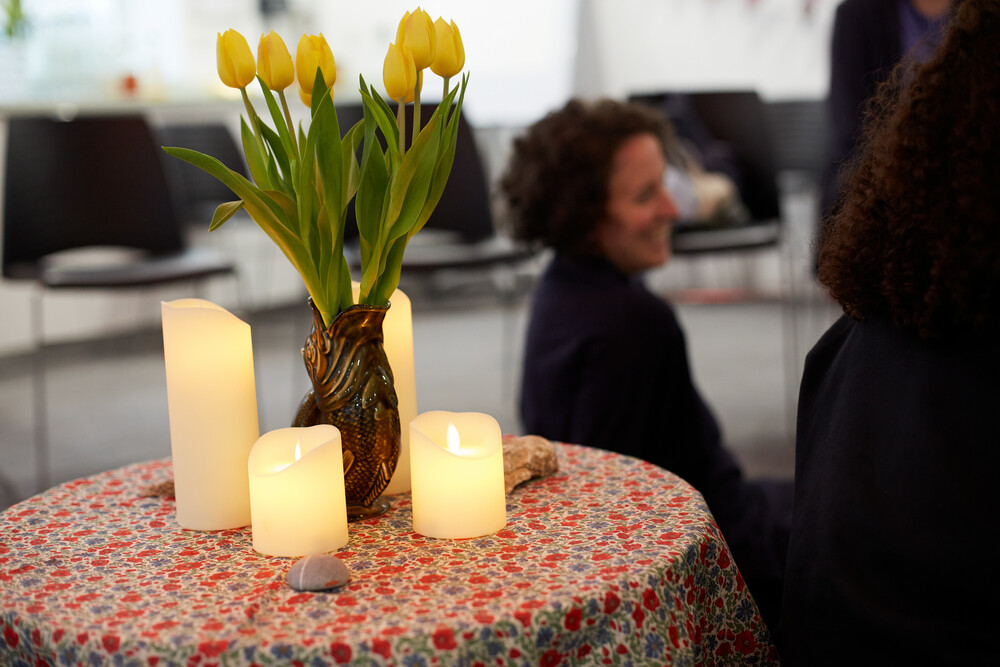 flowers and stones on a worship table