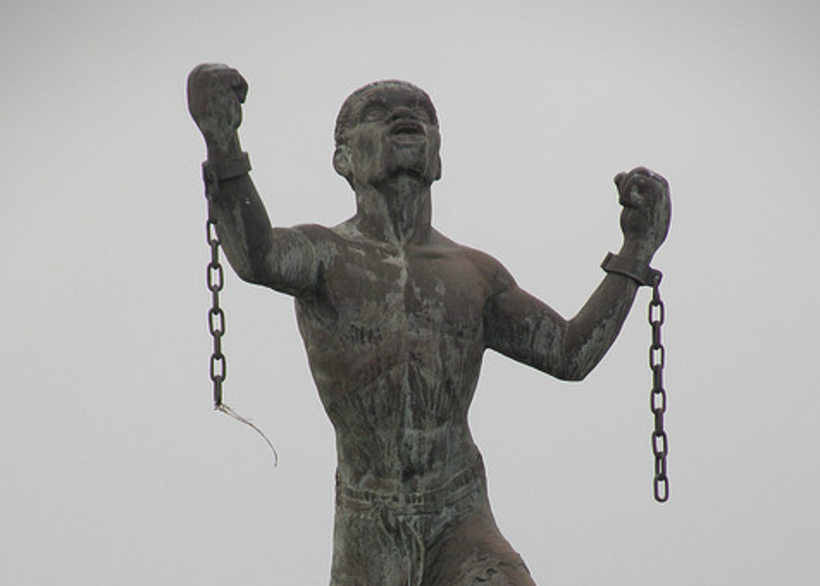 George Fox and other early Friends chose not to condemn the practice of enslaving people. Sculpture: Emancipation Statue (Bridgetown, Barbados) by Karl Broodhagen