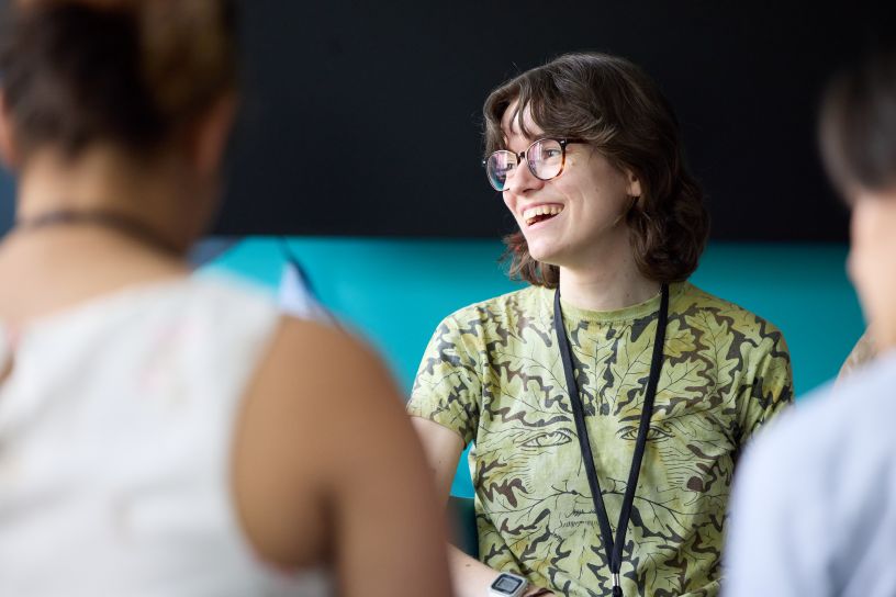 Woman smiling in green top