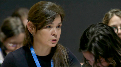 Daria Egereva at COP29 in Baku, Aserbaijan, in November 2024. She is speaking and looking intently off to the right of the image.