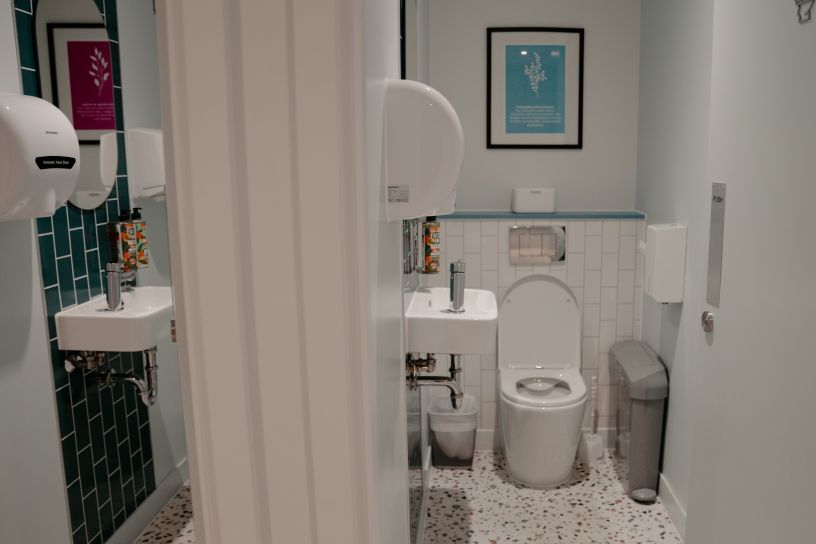 Clean tiled individual toilet cubicles